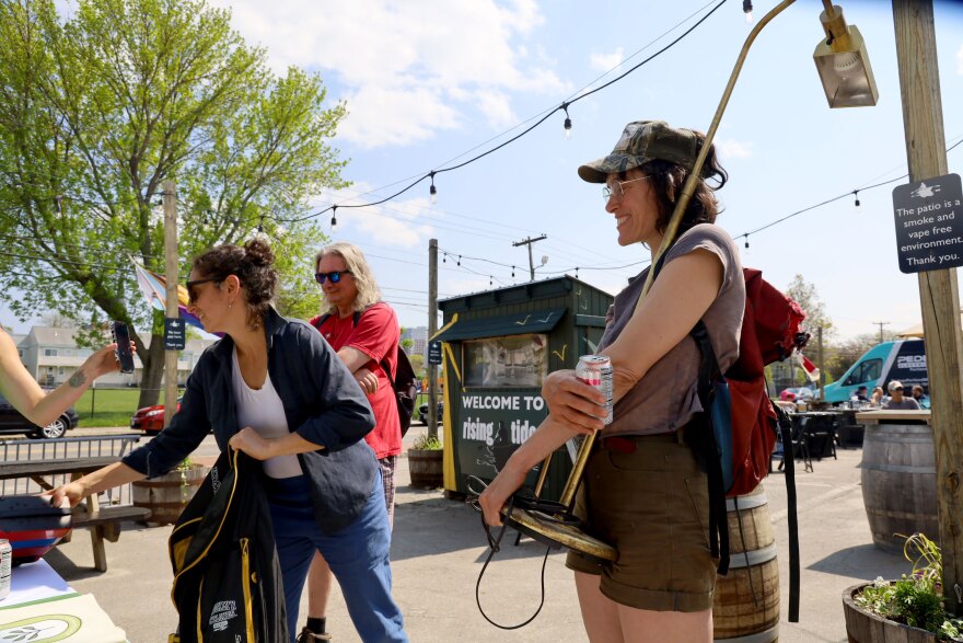 Jessica MilNeil holds her lamp after volunteers helped her fix it at a Repair Café hosted by Maine's Center for Sustainability.