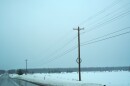 Electric poles and wires along M-32 near Gaylord. Resident Wanda Whiting says lines like this were down during the March 2025 ice storm. (Photo: Vivian La/IPR News)