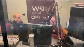 WSIU's Brad Palmer and Blair Allen from NASA EDGE sitting in front of microphones in the WSIU studio discussing the upcoming total solar eclipse experience in Carbondale.