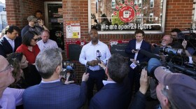 Sen. Tim Scott, R-S.C., talks with reporters during a visit to the Red Arrow Diner, Thursday, April 13, 2023, in Manchester, N.H. Scott on Wednesday launched an exploratory committee for a 2024 GOP presidential bid, a step that comes just shy of making his campaign official. (AP Photo/Charles Krupa)