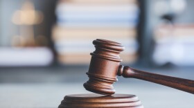 Judge's gavel on table in office.