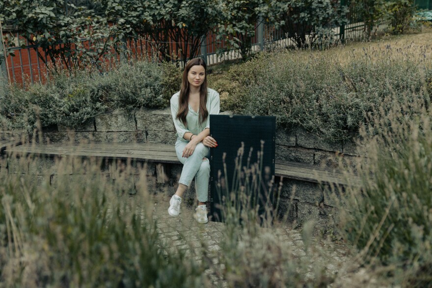 Karolina Attspodina, a Ukrainian-born tech entrepreneur who launched the startup We Do Solar in Berlin, with one of her company's solar panels. Attspodina's work is part of nationwide push to get Germans to use less energy and lessen dependence on Russian oil.