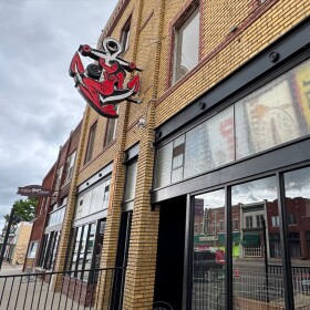 The former home of the Anchor plus two buildings next to it were auctioned on Wednesday and brought in a winning bid of nearly $2 million.