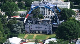 Workers continue building the stage for a future UFC fight on the South Lawn of the White House in Washington, Tuesday, June 9, 2026. (AP Photo/Cliff Owen)