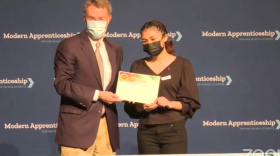 Indianapolis Mayor Joe Hogsett poses for a photo with Ben Davis High School student Ruby Galvan. Galvan will be an apprentice with the city government.