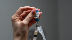 Lauren Ellenburg, a nurse, prepares a combination measles, mumps and rubella vaccine for a patient at Tiger Pediatrics in Easley, S.C., March 17, 2026.