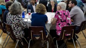 A group of Gainesville citizens, including Commissioner Adrian Hayes-Santos and mayoral candidate Marlon Bruce, express concerns about affordable housing during group brain-storming sessions. (Ashley Lazarski/WUFT News)