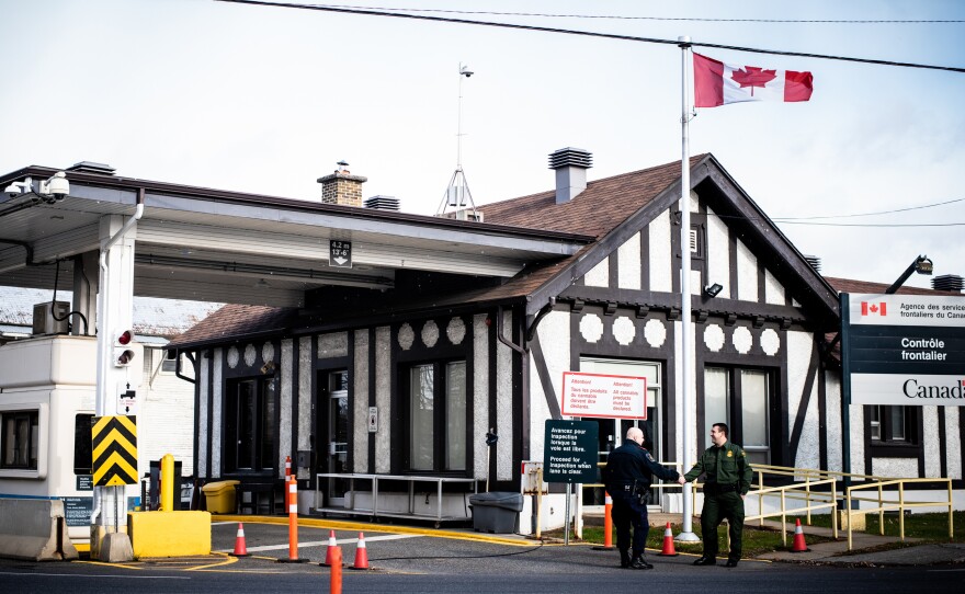 Richard Ross (right), agent in charge of the U.S. Border Patrol's Newport Station, greets a Canadian border agent at the Beebe, Quebec, and Beebe Plain, Vt., crossing.