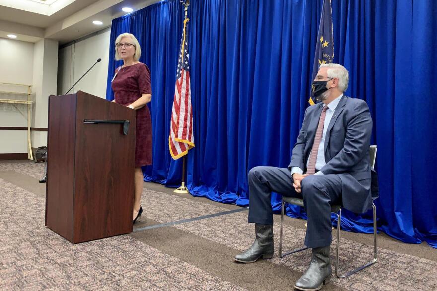 State Health Commissioner Dr. Kris Box, left, and Gov. Eric Holcomb announce the creation of the Indiana Public Health Commission.