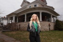 HGTV host Anna Camp stands in front of Bihl Manor in Fremont — the first haunted home to be featured on "A Very Haunted Renovation."