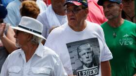 A shirt displaying a fake mug shot of the former president and 2024 presidential candidate Donald Trump is seen during a campaign rally in Pickens, S.C., in July.