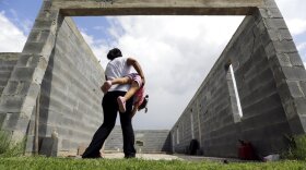 A woman plays with her daughter.