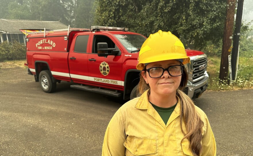 Spokeswoman for Bedrock Fire near fire truck. 