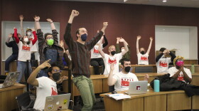 Union members with their arms raised in celebration