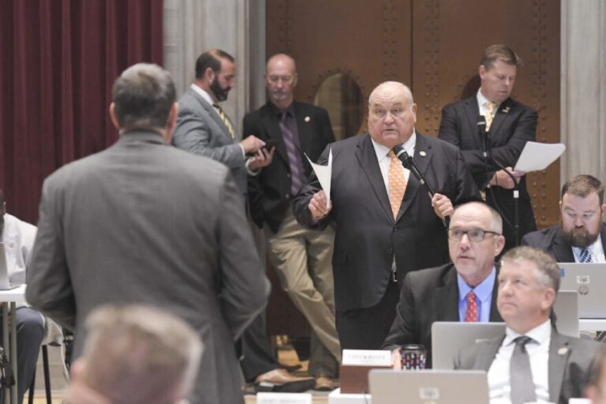  Rep. Don Rone, R-Portageville, at microphone, answers a question from Rep. Mike Haffner, R-Pleasant Hill, during a debate on a package of tax incentives for rural projects.