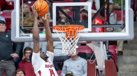 Alabama center Charles Bediako (14) dunks a pass from Alabama guard Labaron Philon Jr. (0) during the first half of an NCAA college basketball game against Missouri Tuesday, Jan. 27, 2026, in Tuscaloosa, Ala. (AP Photo/Vasha Hunt)