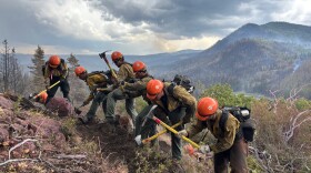 This image provided by the U.S. Forest Service Friday, June 26, 2026, shows firefighters responding to the Cottonwood Fire, June 24, 2026, above Birch Lake, near Beaver, Utah.