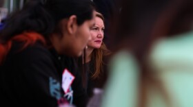 Representative Melanie Stansbury (center) sits in on one of the group discusses during Saturday's Youth Summit