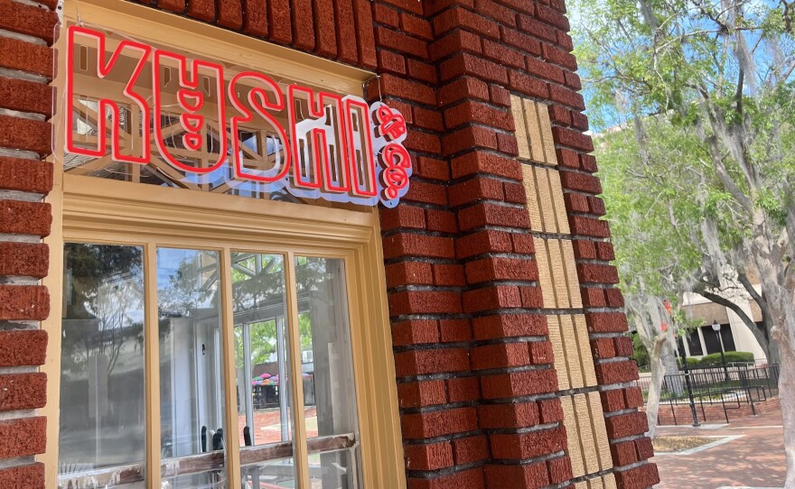 The Kushi & Co. sign is displayed outside the restaurant in Bo Diddley Plaza in downtown Gainesville. The restaurant opened March 4 and specializes in yakitori, a style of skewered street food. (Katie Klaiber, WUFT News)