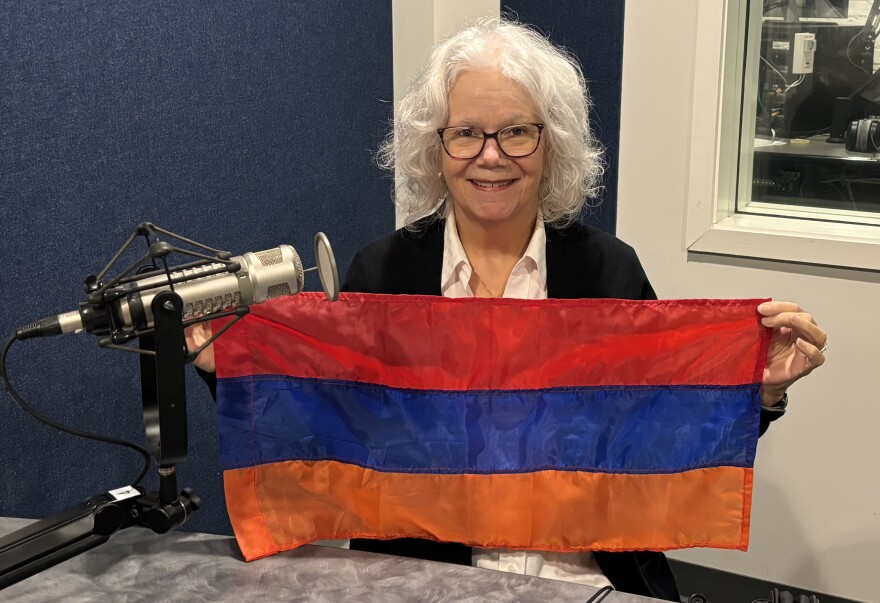 Susan Prentice holds the Armenian flag in WHQR's studio / February 2024