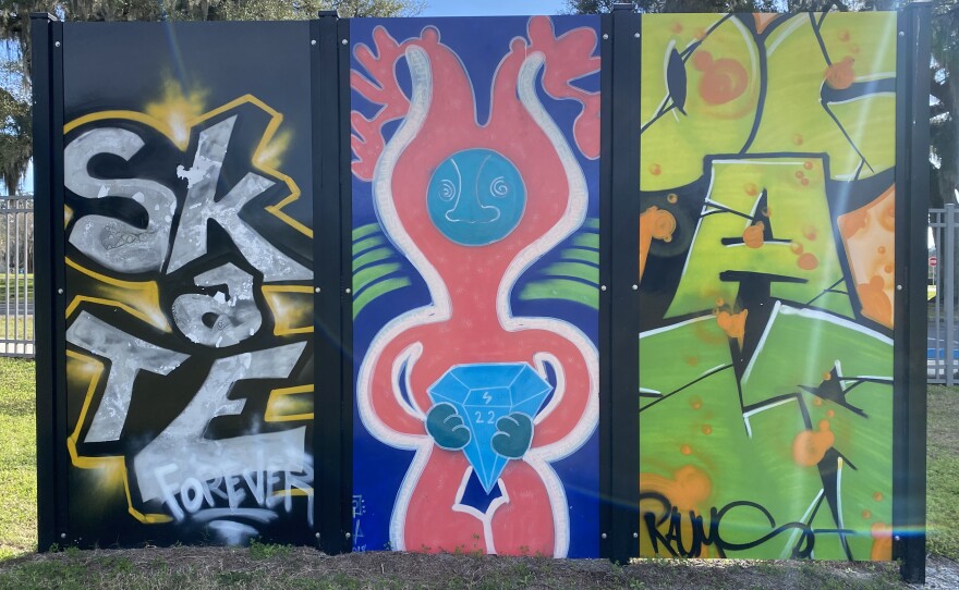 One of the four tri-panel art installations placed around Ocala Skate Park. (Ethan Eibe/WUFT News)