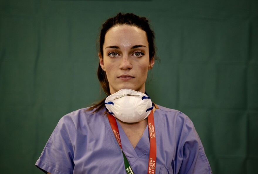 Martina Papponetti, 25, a nurse at the Humanitas Gavazzeni Hospital in Bergamo, Italy poses for a portrait at the end of her shift, March 27, 2020.