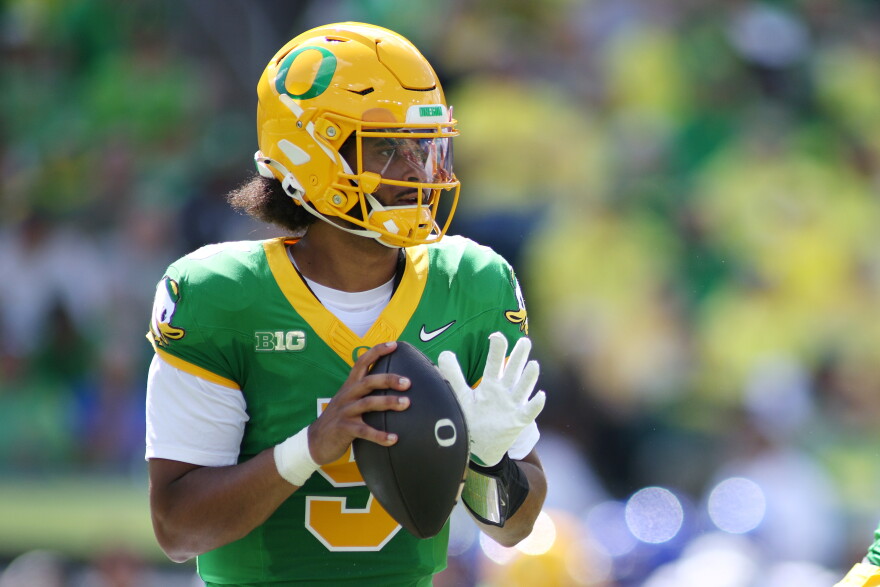 Oregon quarterback Dante Moore (5) looks to pass during the first half of an NCAA college football game against Boise State, Saturday, Sept. 5, 2026, in Eugene, Ore.