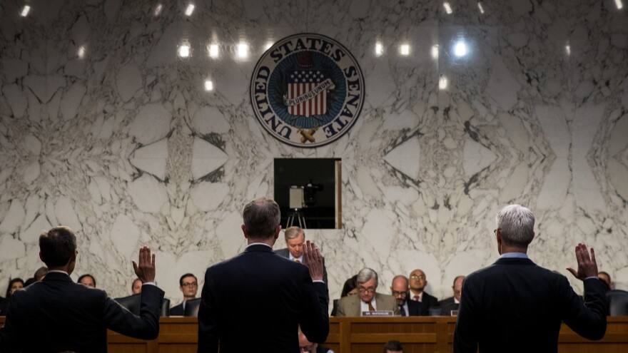 Richard Salgado (from left), director of law enforcement and information security at Google; Sean Edgett, acting general counsel at Twitter; and Colin Stretch, general counsel at Facebook, are sworn in during a Senate Judiciary Subcommittee on Crime and Terrorism hearing on Oct. 31.