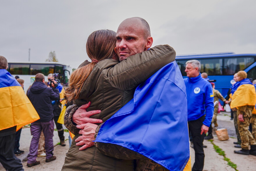 A Ukrainian soldier is welcomed after returning from captivity after a Prisoners of War (POWs) exchange between Russia and Ukraine, at an undisclosed location, Ukraine, Friday, Oct. 23, 2026.