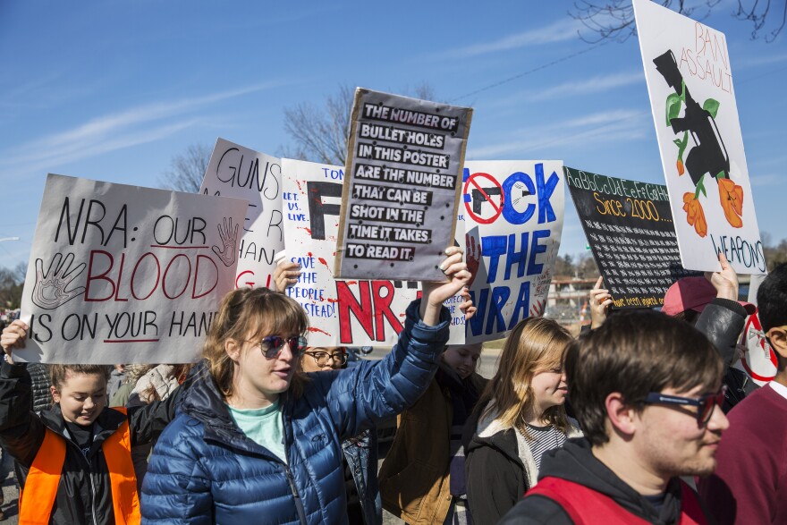 Marchers protested against gun violence and demanded action for gun control policy. 