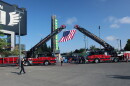 An American flag hangs from two Eugene-Springfield firetrucks at the entrance of the 9/11 Memorial Stair Climb at Autzen on Sept. 11, 2026.