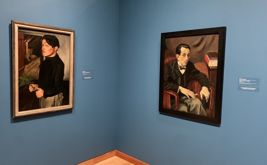 The exhibition includes Self-Portrait with Stinging Nettle by Curt Querner (1933) and Portrait of Geza von Cziffra by Rudolf Schlichter (1926-27).