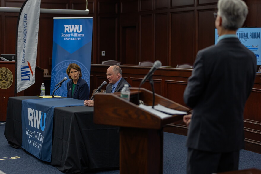 Political Reporter Ian Donnis (right) moderates a discussion between Ken Block and Helena Foulkes. Credit: Rose Wheeler/Ocean State Media
