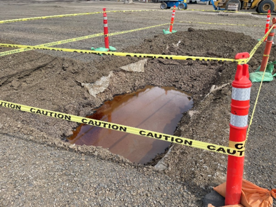 Watery hole surrounded by caution tape. 