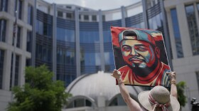 Katheryn Millwee holds a portrait of Kilmar Abrego Garcia outside the federal courthouse Wednesday, June 25, 2025, in Nashville, Tenn. Photo: George Walker IV/AP