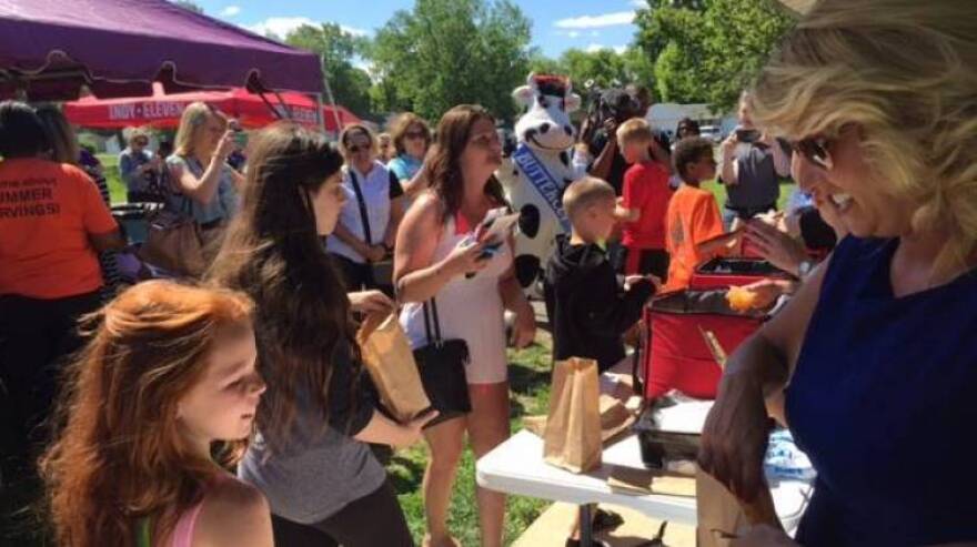 Kids receive food at a federal summer food program in Indianapolis.