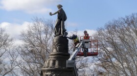 Workers prepare a Confederate Memorial for removal in Arlington National Cemetery on Monday, Dec. 18, 2023 in Arlington, Va. The Confederate memorial is to be removed from Arlington National Cemetery in northern Virginia in the coming days, part of the push to remove symbols that commemorate the Confederacy from military-related facilities.