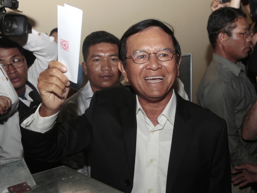 Cambodia National Rescue Party leader Kem Sokha shows his ballot before voting in local elections in Cambodia. His party made a stronger than expected showing.