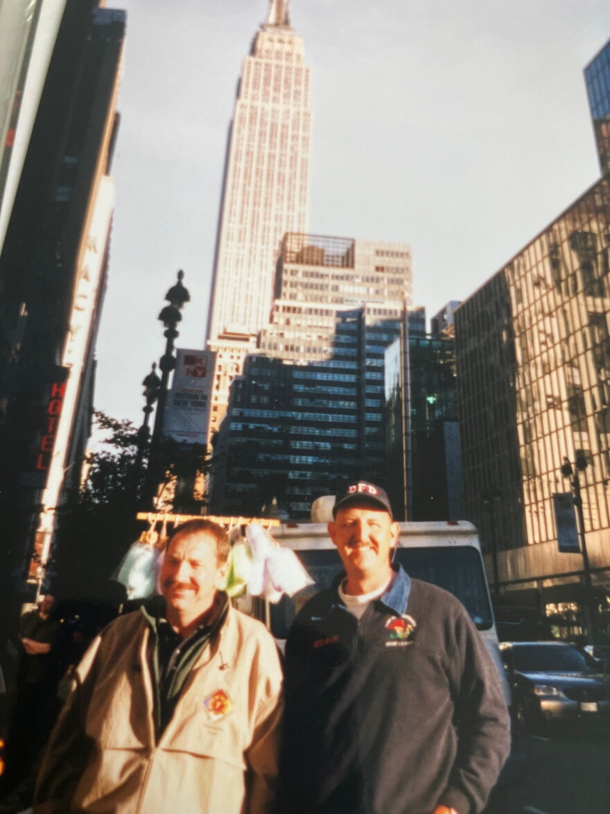An October 2001 photo of Palczynski (right) with Chicago firefighter Ken Wojtecki in Manhattan, with the Empire State Building in the rear.