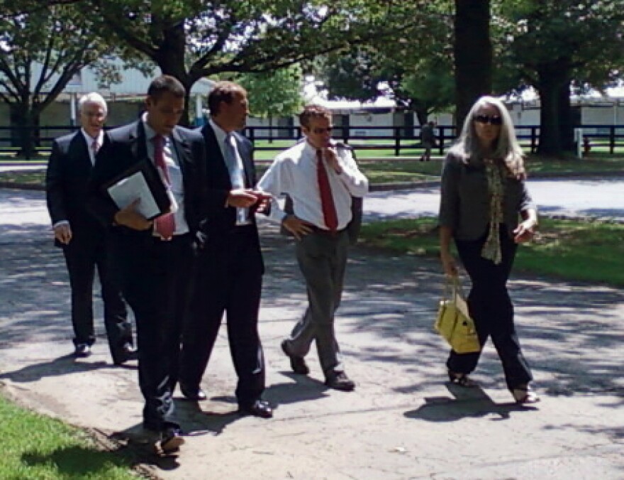 Senator Rand Paul walks and talks with aids after a speech to the Rotary Club of Lexington.