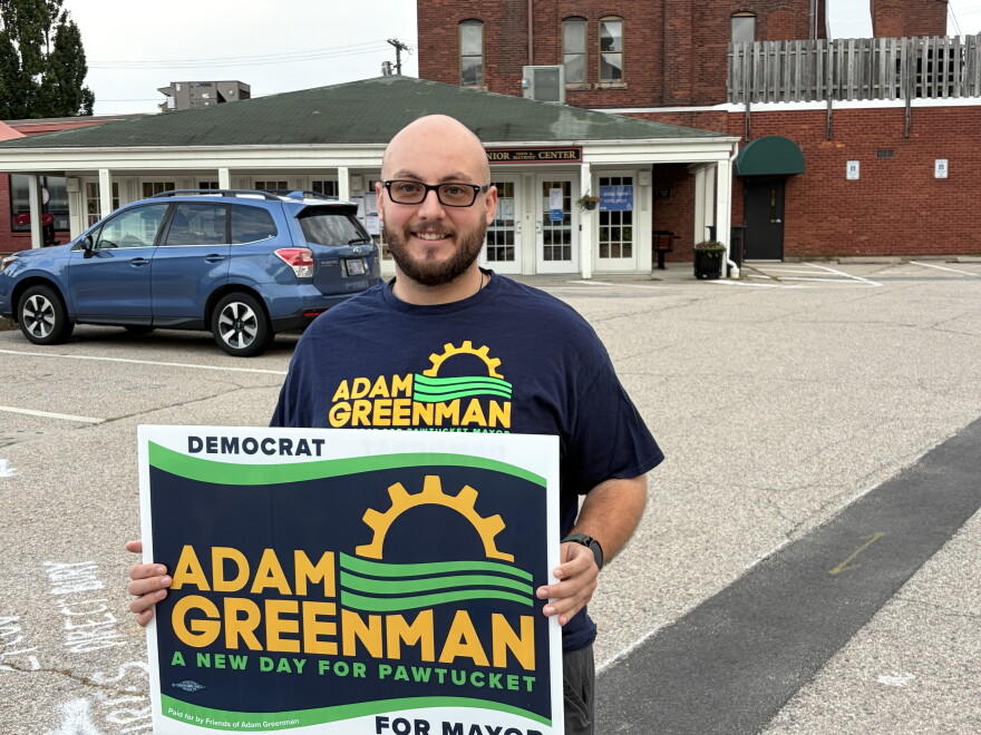 Cameron Segalla, 27, arrived at a Pawtucket polling place early Wednesday morning to show his support for Adam Greenman, running for mayor of Pawtucket. PAUL SINGER/OCEAN STATE MEDIA