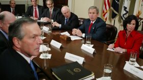 President Bush listens to a reporter's question after meeting with economists, Friday, Jan. 30, 2004, in the Roosevelt Room of the White House. Former Medicaid director Gail Wilensky is pictured at the right. (Ron Edmonds/AP)