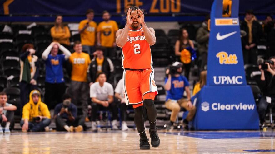 J.J. Starling (2, orange) celebrates a made three-point shot during SU's win over Pitt.