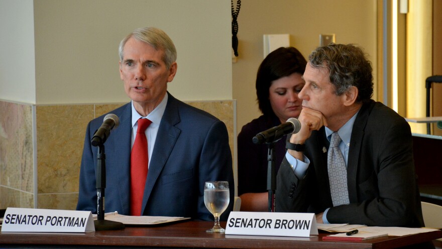 Sens. Rob Portman and Sherrod Brown speak on a panel together in 2016. [Nick Castele / ideastream]