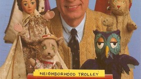 Fred Rogers with his puppets and trolly from "Mister Rogers' Neighborhood."