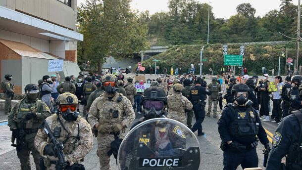 About 200 people showed up to protest outside the Immigration and Customs Enforcement building in Portland on Sunday, Sept. 28.
