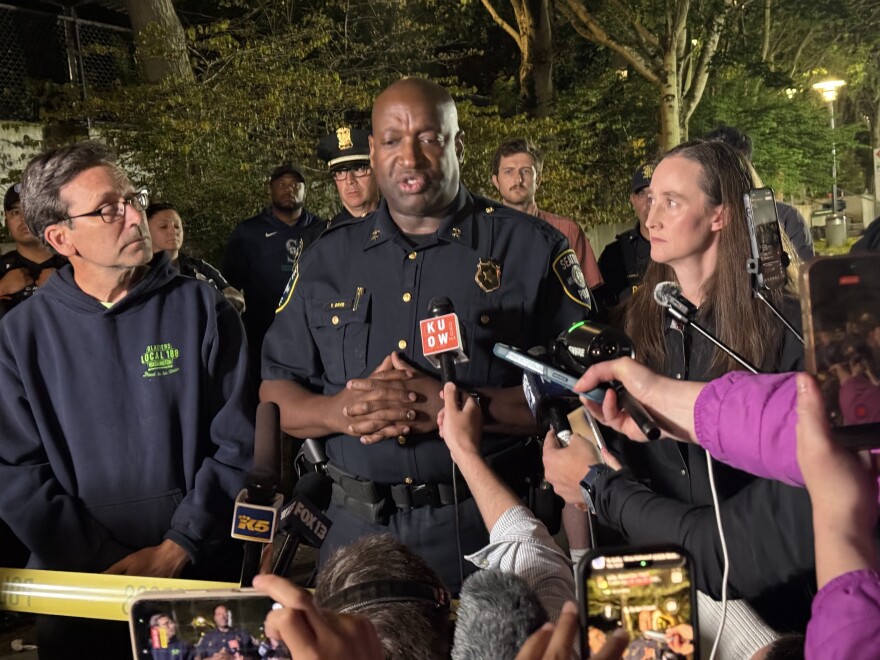 Seattle Police Assistant Chief Tyrone Davis speaks at a press conference with Gov. Bob Ferguson, left, and Seattle Mayor Katie Wilson, right, following a shooting at Seattle Center Sunday, July 26, 2026.