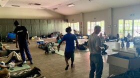 A room filled with people resting on the floor.