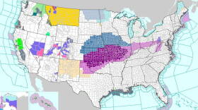 This map from the National Weather Service shows a large chunk the Great Plains and Ohio River Valley covered by either an ice storm warnings (purple), freezing rain advisory (pink) or winter storm watch (blue).