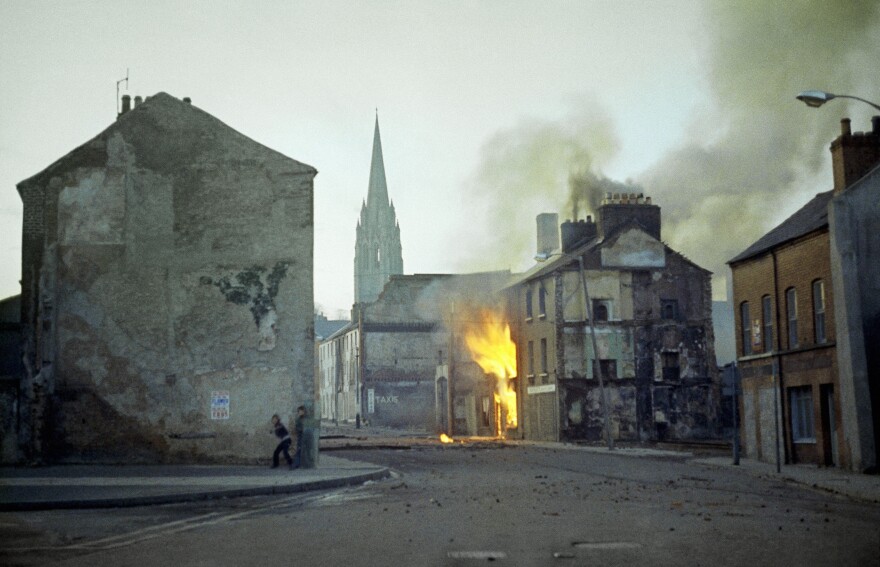 In this February 1972 file photo, a building burns in the bogside district of Londonderry, Northern Ireland, in the aftermath of Bloody Sunday, one of the most notorious events of the period known as the Troubles.